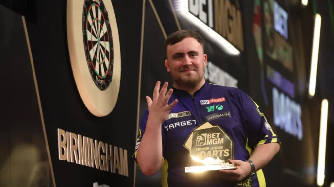 luke-littler-celebrates-winning-final-991347604