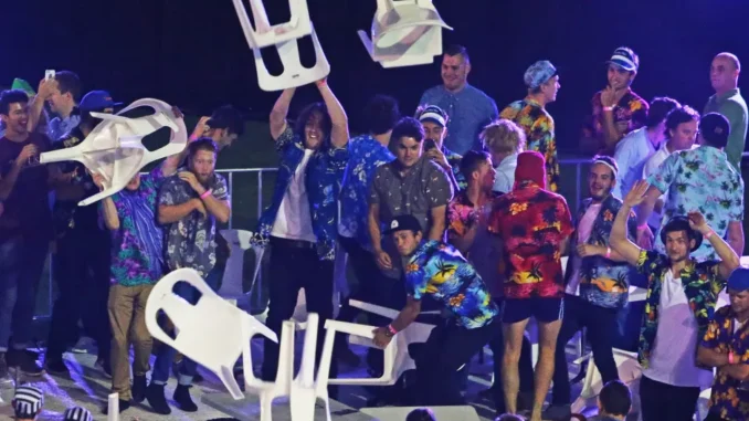 spectators-throw-chairs-tables-final-1017516872
